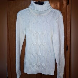 A New York & Co womens cable knit turtleneck wool blend sweater in a medium.